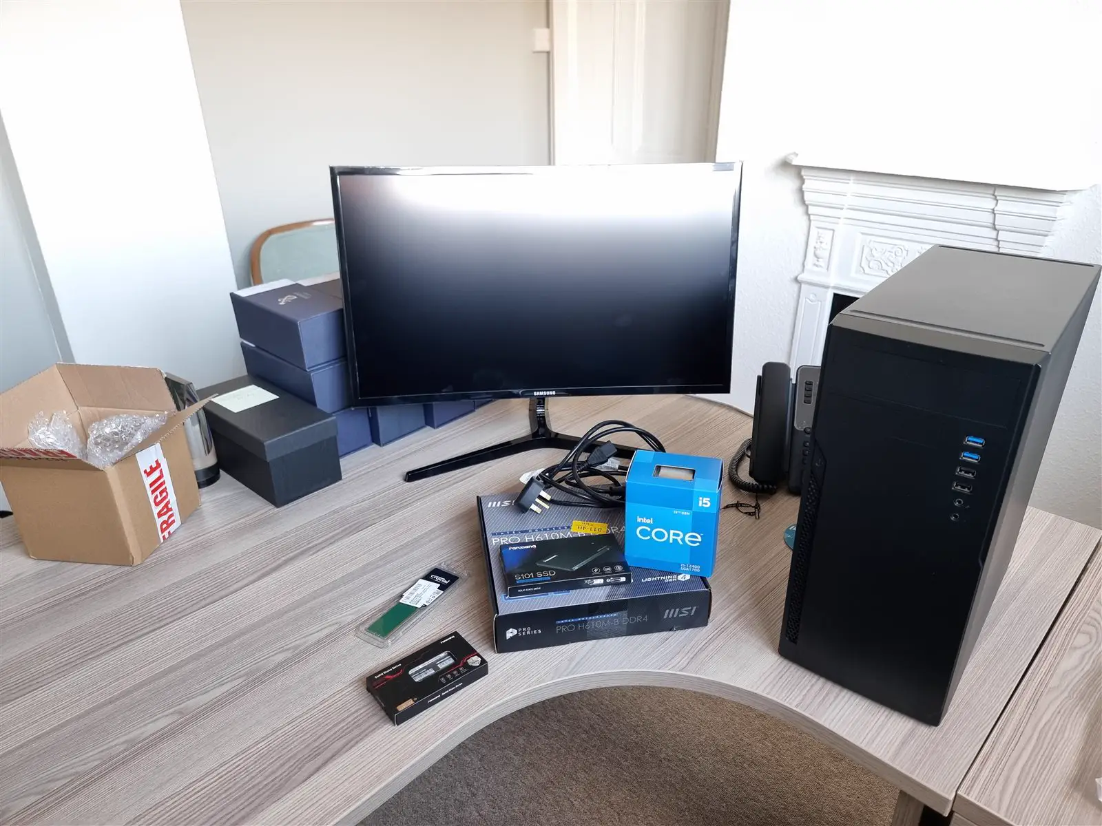 A new office PC and monitor being set up on a desk